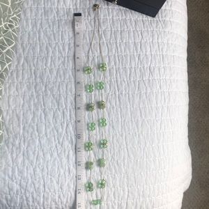 Costume jewelry necklace. Peridot-like with gold accents and clasp